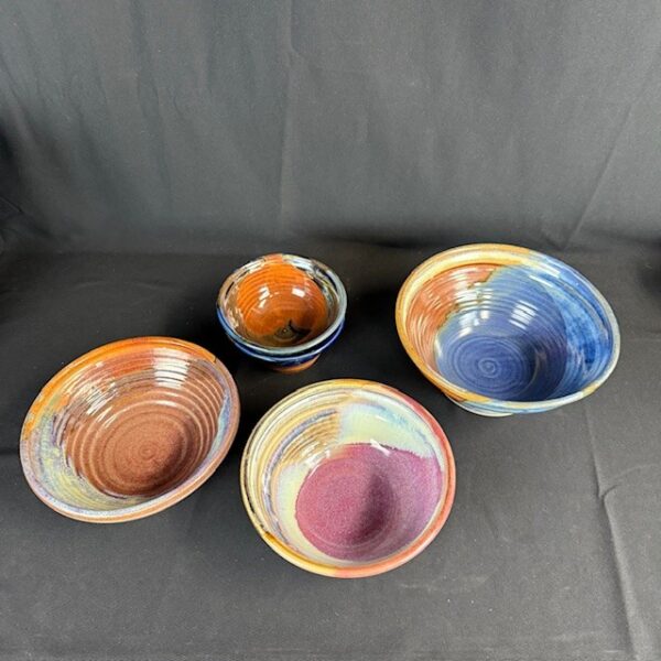 Six Art Pottery Bowls with Colander